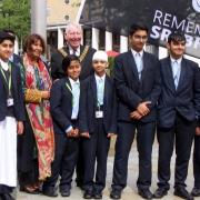 The Lord Mayor of Bradford and Councillor Sabiya Khan with students from Eden Boys School at the flag raising ceremony