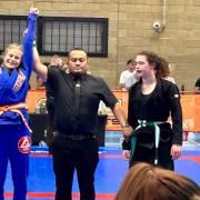 One of Gracie Barra's youngsters, Olivia, celebrates winning gold.