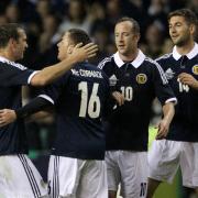 Ross McCormack celebrates a goal for Scotland in August 2012, with Andy Webster, Charlie Adam and Charlie Mulgrew