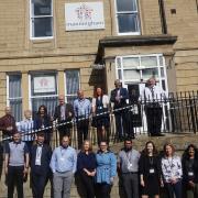 Staff at Manningham Housing Association infront of its head office
