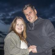 Megan Greenwood got a huge surprise when boyfriend Rhys Whelan proposed with a personalised drones message during the Fireworks Championships in North Yorkshire (Danny Lawson/PA)