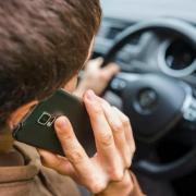 Woman fined for using phone whilst driving