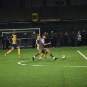 Steeton (yellow and blue) taking on Route One Rovers in happier times at Marley back in October.