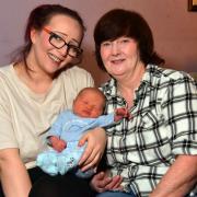 Kimberley Heln with her mum and newborn baby Archie at home in Bradford