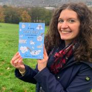 Josephine Dellow with her creation, A Very Yorkshire Colouring Book