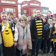 Representatives from Creative Scene, Bespoke Day Services, Keep Hecky Tidy and Kim Leadbeater MP outside the phone box galleries in Heckmondwike