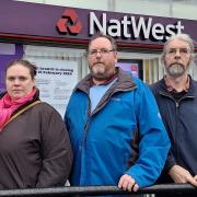 Councillor Aislin Naylor (Lib Dem, Idle and Thackley), Councillor Brendan Stubbs (Lib Dem, Eccleshill), and Councillor Alun Griffiths (Lib Dem, Idle and Thackley) outside the NatWest bank in New Line, Greengates which is set to close early next year