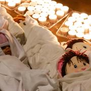 A vigil with dolls symbolising children that have died during the ongoing conflict outside Downing Street, London