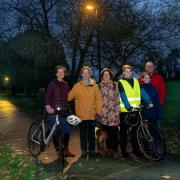 From left, with dogs: Katie Birks, Elaine Hiser, Fiona Protheroe, Will Hiser-Dobson, Isla Hiser Dobson and Richard Dobson in Skipton’s Aireville Park, where new lighting has been introduced.