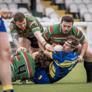 Three West Bowling players combine to put in a crunching tackle on Oulton Raiders second row David Jagger last season at Horsfall.