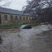 A car submerged in water in Brighouse