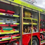 Firefighters helped to rescue a person who was trapped in a car in Keighley