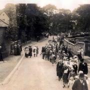 This Sunday school walking day, passing the King's Arms Inn, at Sutton-in-Craven, is believed to have been photographed in 1936