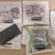 Two phones, more than £700 in cash, and a quantity of cannabis were seized after a police stop in Bradford last night