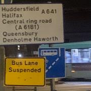 A bus lane suspension sign for Bridge Street in Bradford.
