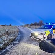 Police at scene of crash on icy road amid weather warning