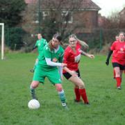Action from the WRCWFL Shield Preliminary Round match between Pontefract Sports & Social and Bradford (Park Avenue) Ladies (in green), pic courtesy of Kacie's Photography