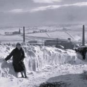 Olive Holden braves the snow in Denholme, January 1963. Picture: Fred Holden.