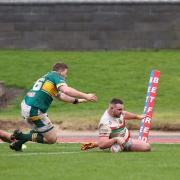Captain Ellis Robson slides over in the corner to put Keighley in front at Hunslet yesterday.