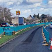 Blue barriers have been put up Rooley Lane as works by Northern Powergrid begins. The work is causing traffic to back up.