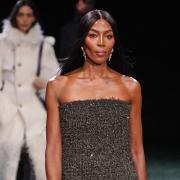 Naomi Campbell walks the runway for Burberry
