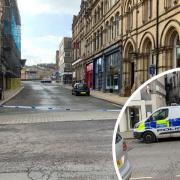 A police cordon in place in Silver Street, between its junctions with Commercial Street and Central Street, with Crime Scene Investigation there