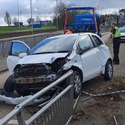 Car collides with railings on major Bradford road