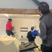 Volunteers paint the Millan Centre