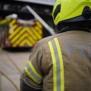 Two people were helped out of a fire-hit home in Bradford by crews