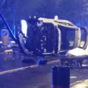 An adult and child were injured after a car overturned on Tong Street in Bradford last night.