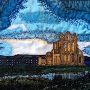 An upcycled fabric collage of Whitby Abbey