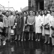 Women gather at Menston Station for a Mothers' Union trip to Holland, 1969