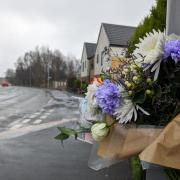 Floral tributes left on Bolton Road near the junction of Boars Well Drive