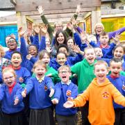 The children at St Columba's Catholic Primary School celebrating the new Ofsted rating
