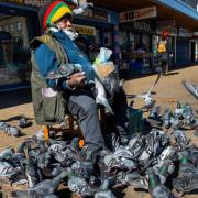 Barry Roots, renowned Bradford pigeon feeder, is one of the images on display. Pic: Rais Hasan