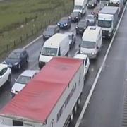Traffic is stationary on the M62 following a crash between Junctions 22 and 23.