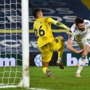 Stuart Dallas stoops to score for Leeds in a Premier League game against Newcastle in December 2020.