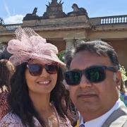 Reverend Nathan Javed e and his wife Urpha in the grounds of Buckingham Palace