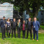 Head boy Rohan Chand, head girl Lucy Rhodes, Sam Ryan, Astrid Gamesby, Safa Azeem, Cole Burgess and headteacher Steve Mulligan celebrate Immanuel College receiving a Good rating by Ofsted