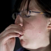 Photo of a woman coughing
