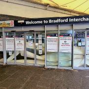 A variety of signs on the front ofBradford Interchange are evidence of the ongoing problems