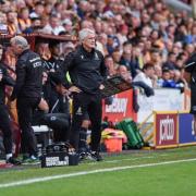 Michael Flynn, right, on the Valley Parade touchline with Mark Hughes
