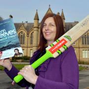 Joanne Christie of the University School Of Management is pictured with a few items for the auction