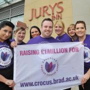 Jenny Watkinson and Victoria Collins from Bradford University join Jury’s Inn operations manager Mark Bussey and staff, ahead of the Crocus Week abseil