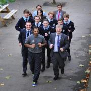 Teachers and Pupils from St Bede's and St Joseph's Catholic College ahead of them taking part in the Bradford City Runs