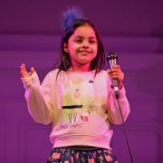 Sahara Khan from Lidget Green Primary performs on stage at the Festival of Talent contest