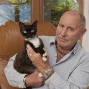 Bill Lowe with Checkie, his current Devon Rex cat