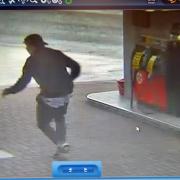A CCTV image of the thief running to steal Mohammed Gafoor's taxi at the Texaco filling station in Great Horton Road, Horton Bank Top