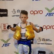 Patrick Coleman shows off his golden gloves