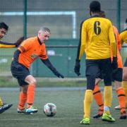 Lee Reilly (orange) scored twice for Oxenhope Recreation in their heavy West Riding County Challenge Cup defeat to Church Fenton Picture: Andy Garbutt